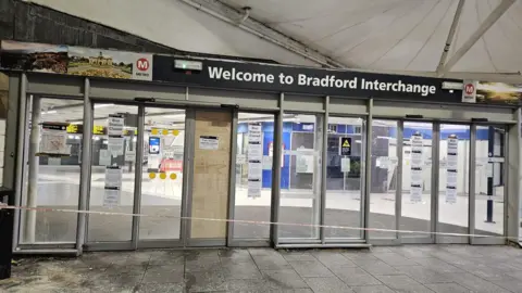Aisha Iqbal/BBC The entrance to Bradford Interchange bus station with tape across the front