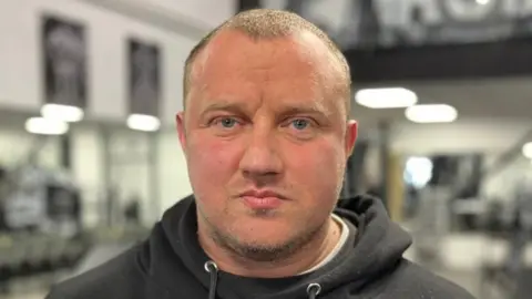 Shaun Whitmore/BBC John Lock