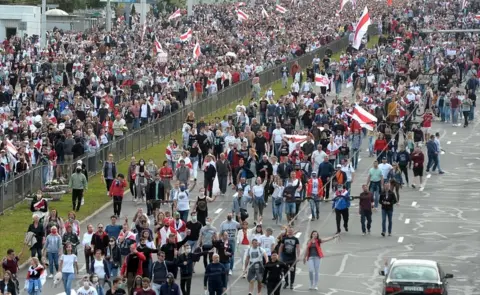 EPA Protesters march during a rally to protest against the presidential election results in Minsk, Belarus, 13 September 2020