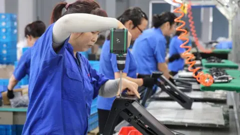 Getty Images Factory workers