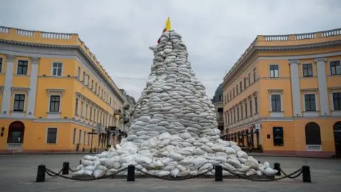 Getty Images Sandbags piled up around the statue of the Duc de Richelieu in Odesa in March 2022