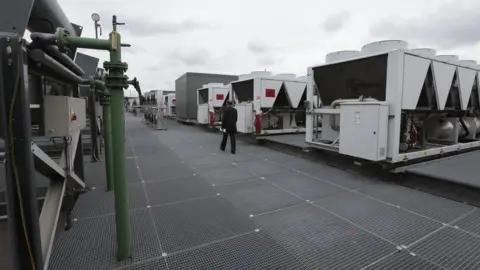 Getty Images Air conditioning units on top of a building