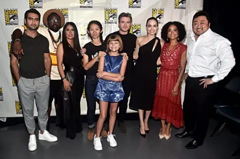 Getty Images Chloe Zhao (fourth from left) with the cast of Eternals