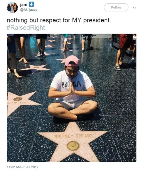Twitter / @fcknjaaay Man kneeling next to Britney Spears Hollywood star. Tweet saying: nothing but respect for MY president.