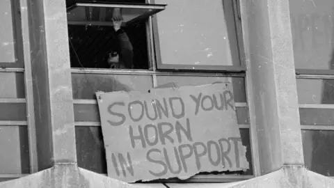 Getty Images 'Sound Your Horn in Support' sign