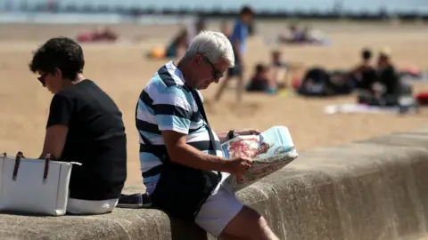 PA Man reading newspaper