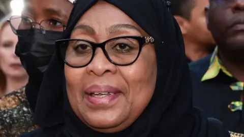 Getty Images President of Tanzania Samia Suluhu Hassan attends the Los Angeles premiere of "Tanzania: The Royal Tour" at Paramount Studios on April 21, 2022 in Los Angeles