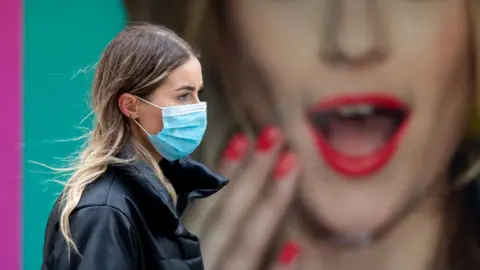 Getty Images Face masks will still be required until at least the end of March