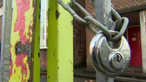 BBC Generic shot of school closed with lock on gate