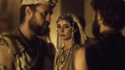 BBC/Wild Mercury The picture shows Menelaus (Jonas Armstrong), Helen (Bella Dayne), Paris (Louis Hunter) in Troy: Fall of a City
