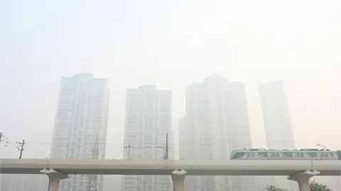 Getty Images Delhi Metro rail seen on a smoggy morning amid rising air pollution levels at Sector 78 on November 5, 2023 in Noida, India