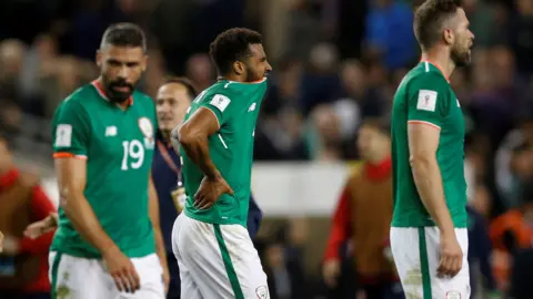 Reuters Dejected Republic of Ireland players after the defeat to Serbia