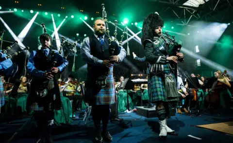 CBoI Bagpipe players performing with the Cross-Border Orchestra of Ireland