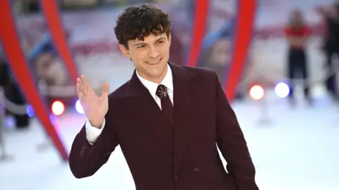 Getty Images Tom Holland waving for cameras