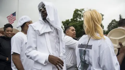 Getty Images Greg Crockett wore all white as Castile's pallbearer