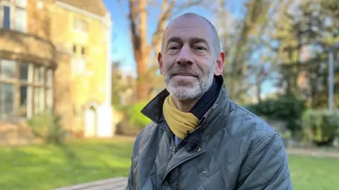 Emma Baugh/BBC Head and shoulders of charity worker