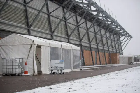 PA Media The NHS Covid-19 vaccination centre at the Jobserve Community Stadium in Colchester, on 7 February 2021