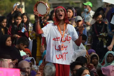 Getty Images People take part in the 'Aurat March' or women's march, an annual socio-political demonstration held to observe International Women's Day, in Karachi on March 12, 2023.