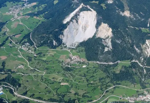 Christoph Nänni, Tiefbauamt GR, Switzerland This aerial view of Brienz by Christoph Nänni shows the village of Brienz directly beneath the mass of rock