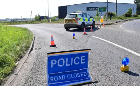 Pacemaker Moira road closure in Crumlin police sign