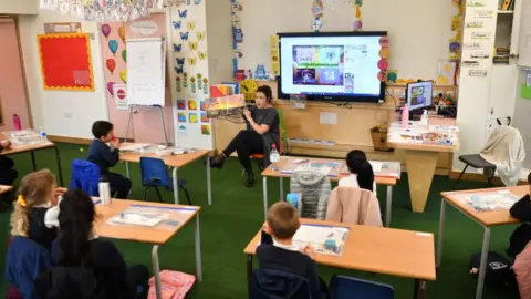 Getty Images A teacher in a socially-distanced classroom