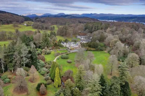 Historic England Aerial view of gardens around house