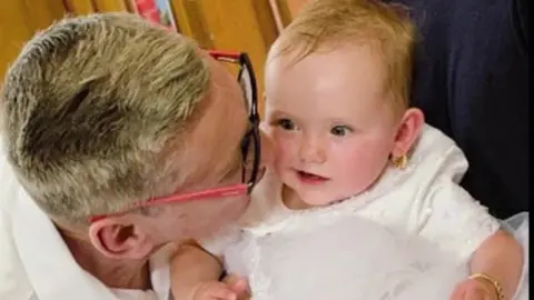 Grenfell Inquiry Anthony Disson with his granddaughter Talleulah