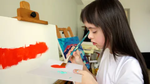 DenKuvaiev/Getty Images Girl painting