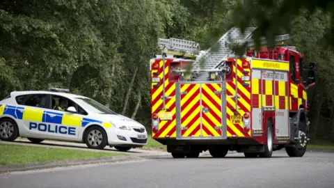 South Beds News Agency Police car and fire engine outside The Mount