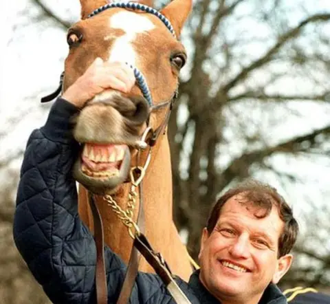 PA Former jockey Bob Champion and his Grand National winning horse Aldaniti