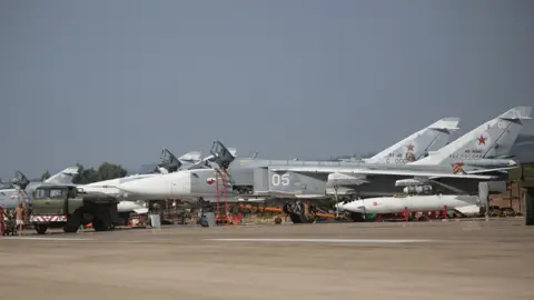 AFP Russian Su-24 bombers at Hmeimim airbase, 6 Oct 15