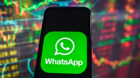 Getty Images WhatsApp logo on phone