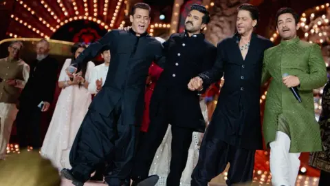Reuters Actors Salman Khan, Ram Charan, Shah Rukh Khan and Aamir Khan perform during the pre-wedding celebrations of Anant Ambani, son of Mukesh Ambani, the Chairman of Reliance Industries, and Radhika Merchant, daughter of industrialist Viren Merchant, in Jamnagar, Gujarat, India, March 2, 2024