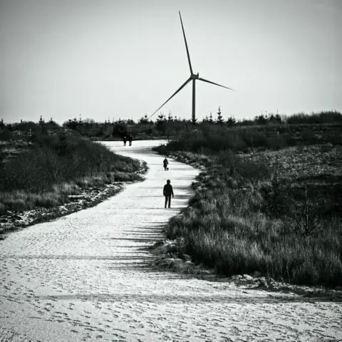 John McQuade Winding road to wind turbine
