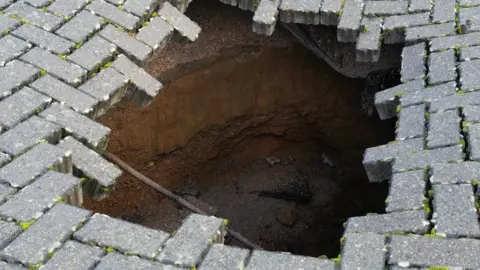 sinkhole in car park