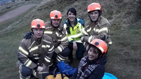 West Midlands Ambulance Service Yasmin Khan (centre) with her rescuers from West Midlands Ambulance Service and Hereford and Worcester Fire and Rescue Service
