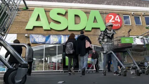 Getty Images Shopper leaves Asda