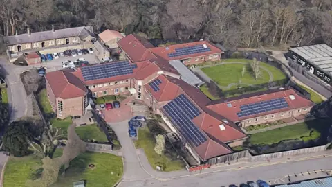 Google Fromeside as shown from above. Red-roofed building with gardens.
