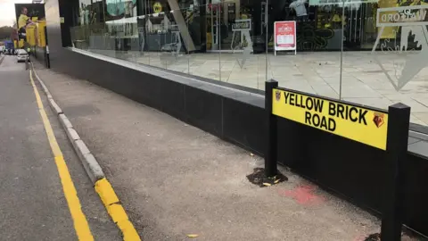 BBC/Tony Fisher Yellow Brick Road sign