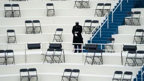 Pool/Getty Images Chairs are arranged to allow for social distancing at the inauguration rehearsal