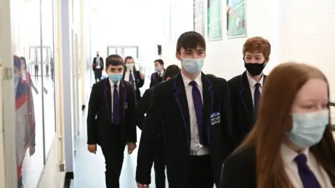 Getty Images A Year 9 class walk along a corridoor at Park Lane Academy in Halifax, northwest England on March 4, 2021.