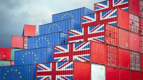 Getty Images Containers bearing the Union Jack and the EU flag