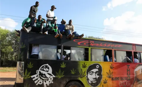 EPA Fans of Kenyan club Gor Mahia cheer on top of a matatu after their team played against during Tunisian club Esperance during the CAF Champions League first round match between Gor Mahia and Esperance Tunis, in Machakos, Kenya, 07 March 2018.