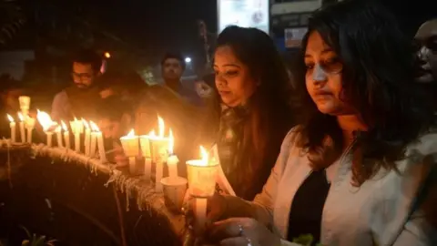 AFP Indian mourners take part in candle light vigil as they pay homage to the killed service members in Siliguri