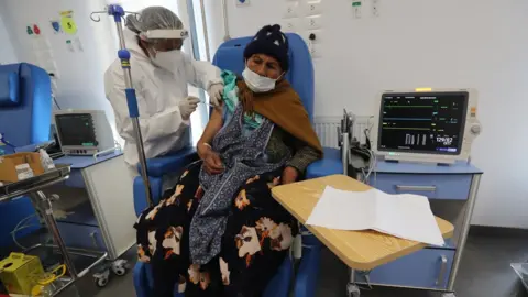 European Pressphoto Agency Vaccine being given to woman in Bolivia