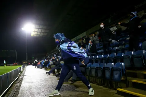Getty Images A Wycombe Wanderers fan reacts