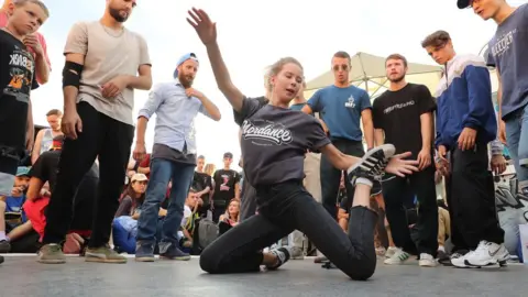 Getty Images A woman breakdances at a festival in Moscow's Gorky Park