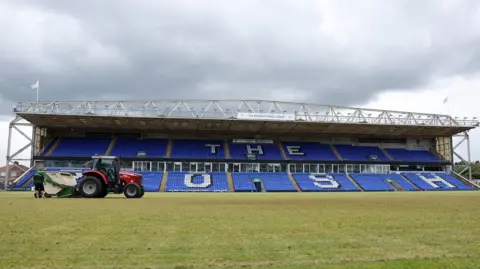 Peterborough United FC A red tractor on the pitch at Weston Homes Stadium