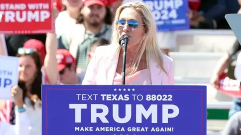 EPA Marjorie Taylor-Greene speaks to the crowd during the Trump rally