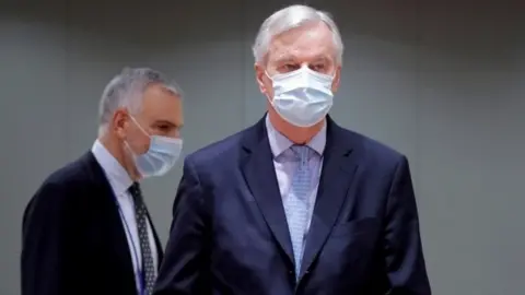 Reuters European Union"s chief Brexit negotiator Michel Barnier holds the pages of Brexit trade deal as he attends a meeting of the Committee of the Permanent Representatives of the Governments of the Member States to the European Union (COREPER) in Brussels,